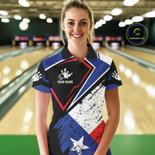 Load image into Gallery viewer, Woman wearing a grunge Texas flag bowling polo shirt at a bowling alley front view.