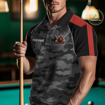 Man wearing a grey camouflage American flag 8 ball billiard jersey beside a pool table front view.