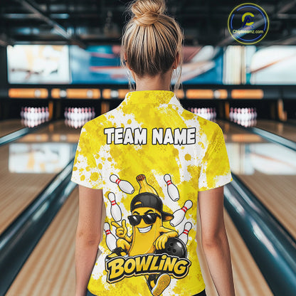 Back view of woman wearing a funny yellow banana bowling polo shirt inside a bowling alley.