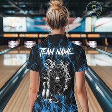 Load image into Gallery viewer, Back view of woman wearing a blue flaming panther bowling polo shirt inside a bowling alley.
