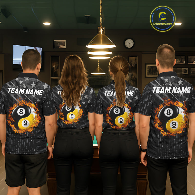 Group of men and women wearing matching black billiard team polo shirts with distressed silver star patterns, personalized "Your Name" details, and 8-ball & 9-ball graphics, posing together beside a pool table in a billiards hall.
