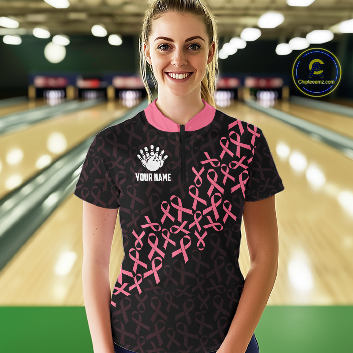 Woman wearing pink ribbon American flag bowling team jersey quarter zip shirt featuring breast cancer awareness artwork, front view.