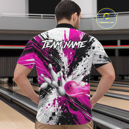 Back view of man wearing a pink splatter bowling quarter zip shirt in a bowling alley.