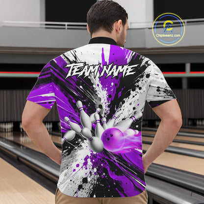 Back view of man wearing a purple splatter bowling quarter zip shirt in a bowling alley.