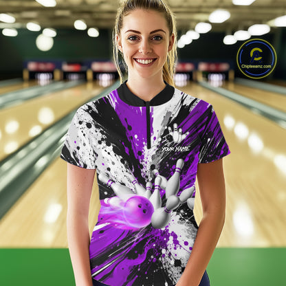 Woman wearing a purple splatter bowling quarter zip jersey during league competition front view.