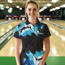 Load image into Gallery viewer, Woman wearing a dreamy blue bowling polo shirt at a bowling alley front view.