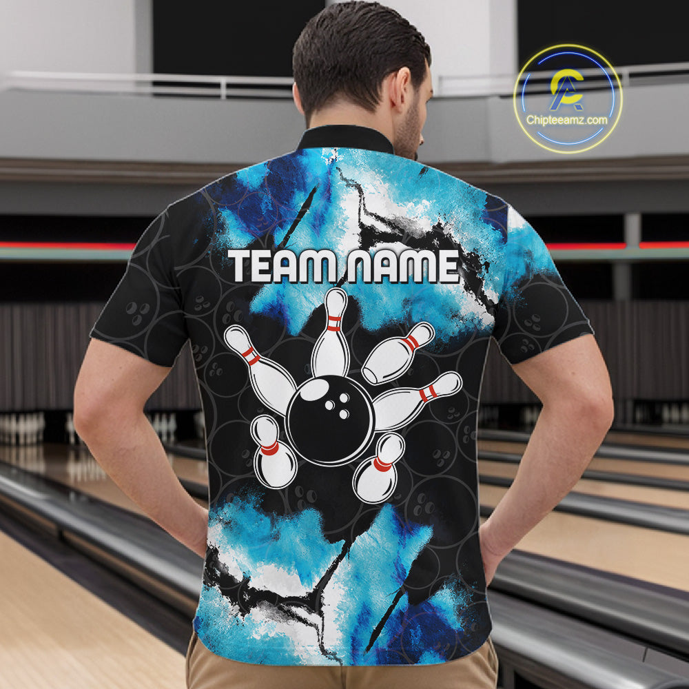 Back view of man wearing a dreamy blue bowling quarter zip shirt in a bowling alley.