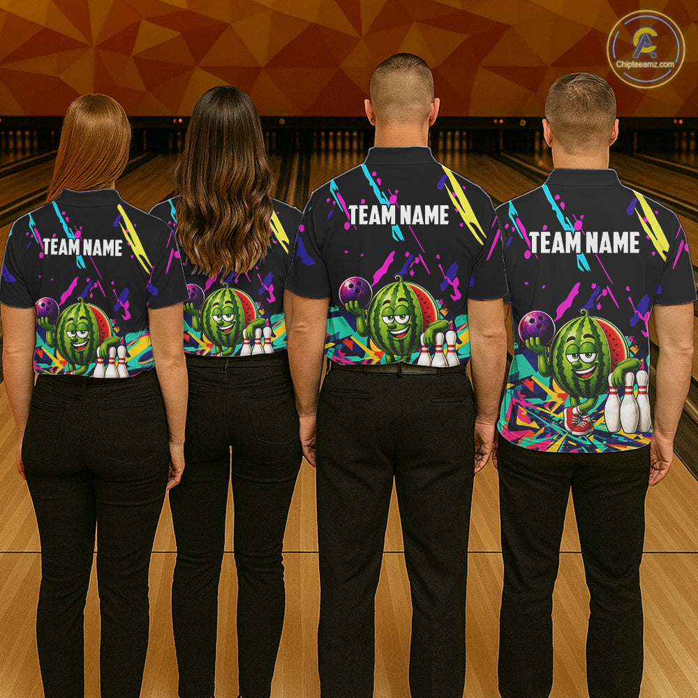 Back view of bowling team wearing matching watermelon bowling shirts in a bowling alley.
