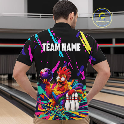 Person wearing a colorful bowling-themed shirt with a rooster design in a bowling alley.