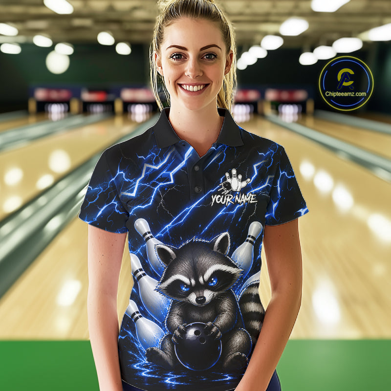 Woman wearing a blue neon lightning raccoon bowling polo shirt at a bowling alley front view.