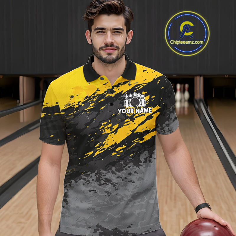 Man wearing a yellow funny banana bowling polo shirt at a bowling alley front view.