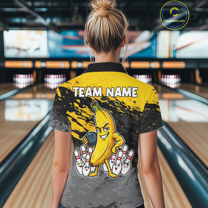 Back view of woman wearing a yellow funny banana bowling polo shirt inside a bowling alley.