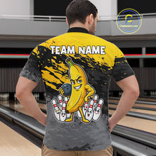 Load image into Gallery viewer, Back view of man wearing a yellow funny banana bowling quarter zip shirt in a bowling alley.