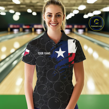 Woman wearing a US flag Texas bowling polo shirt at a bowling alley front view.