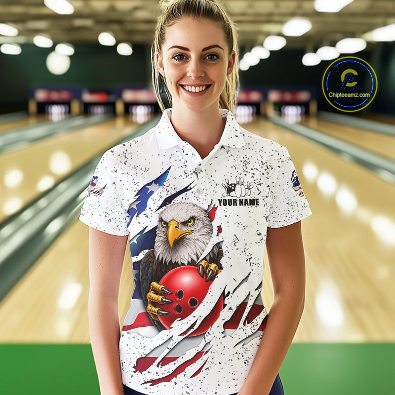 Woman wearing a white grunge American flag eagle bowling polo shirt at a bowling alley front view.