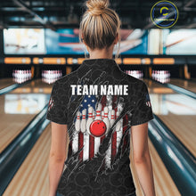 Load image into Gallery viewer, Back view of woman wearing a vintage American flag black bowling polo shirt inside a bowling alley.
