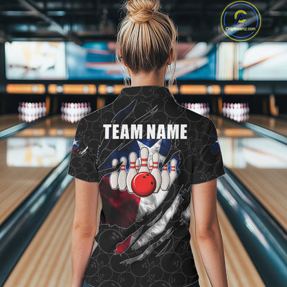 Back view of woman wearing a smoke Texas flag black bowling polo shirt inside a bowling alley.