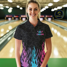 Load image into Gallery viewer, Woman wearing a fire flame neon bowling polo shirt at a bowling alley front view.
