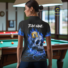 Load image into Gallery viewer, Back view of woman wearing a blue flaming skull pool shirt in a billiards hall.