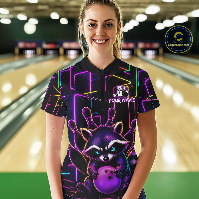 Woman wearing a funny purple neon raccoon bowling quarter zip jersey during league competition front view.