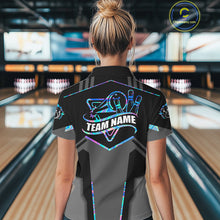 Load image into Gallery viewer, Back view of woman wearing a holographic bowling polo shirt inside a bowling alley.