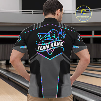 Back view of man wearing a holographic bowling quarter zip shirt in a bowling alley.