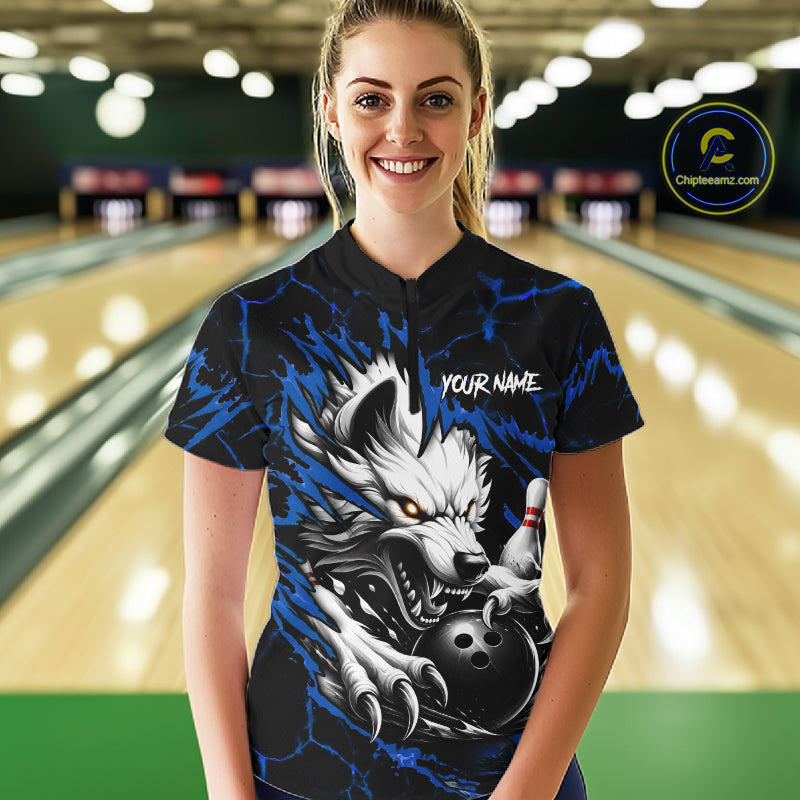 Woman wearing black and blue custom wolf bowling team jersey quarter zip shirt featuring wolf artwork, front view.