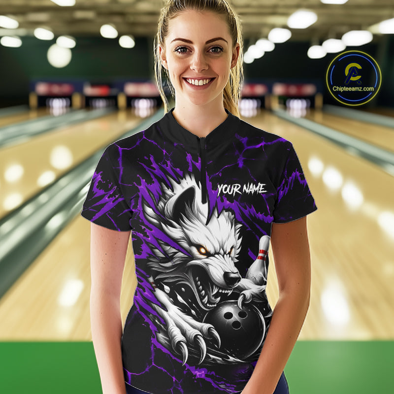 Woman wearing black and purple custom wolf bowling team jersey quarter zip shirt featuring wolf artwork, front view.