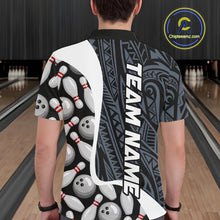Load image into Gallery viewer, Back view of man wearing a blue tribal pattern bowling polo shirt inside a bowling alley.