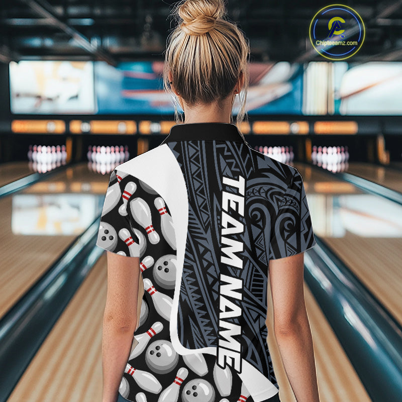 Back view of woman wearing a blue tribal pattern bowling polo shirt inside a bowling alley.