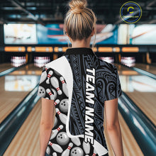 Load image into Gallery viewer, Back view of woman wearing a blue tribal pattern bowling polo shirt inside a bowling alley.