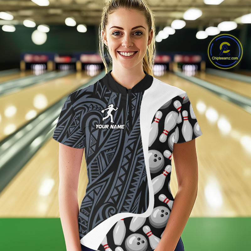 Woman wearing a blue tribal pattern bowling quarter zip jersey during league competition front view.