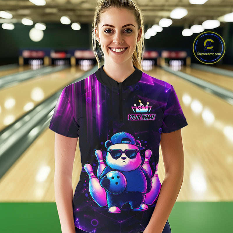 Back view of woman wearing a neon panda bowling polo shirt inside a bowling alley.
