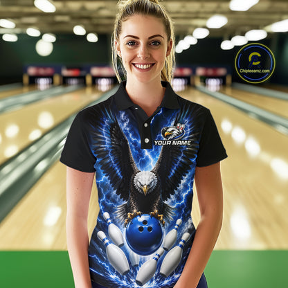 Woman wearing a blue thunder lightning eagle bowling polo shirt at a bowling alley front view.