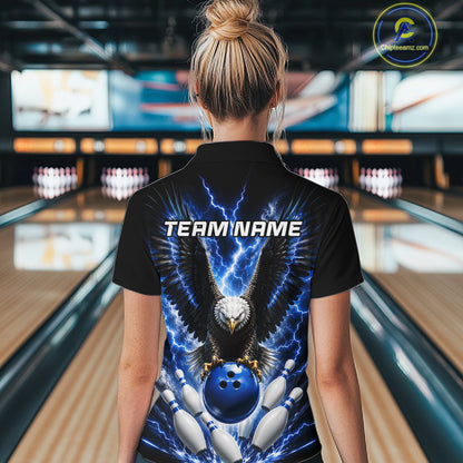Back view of woman wearing a blue thunder lightning eagle bowling polo shirt inside a bowling alley.
