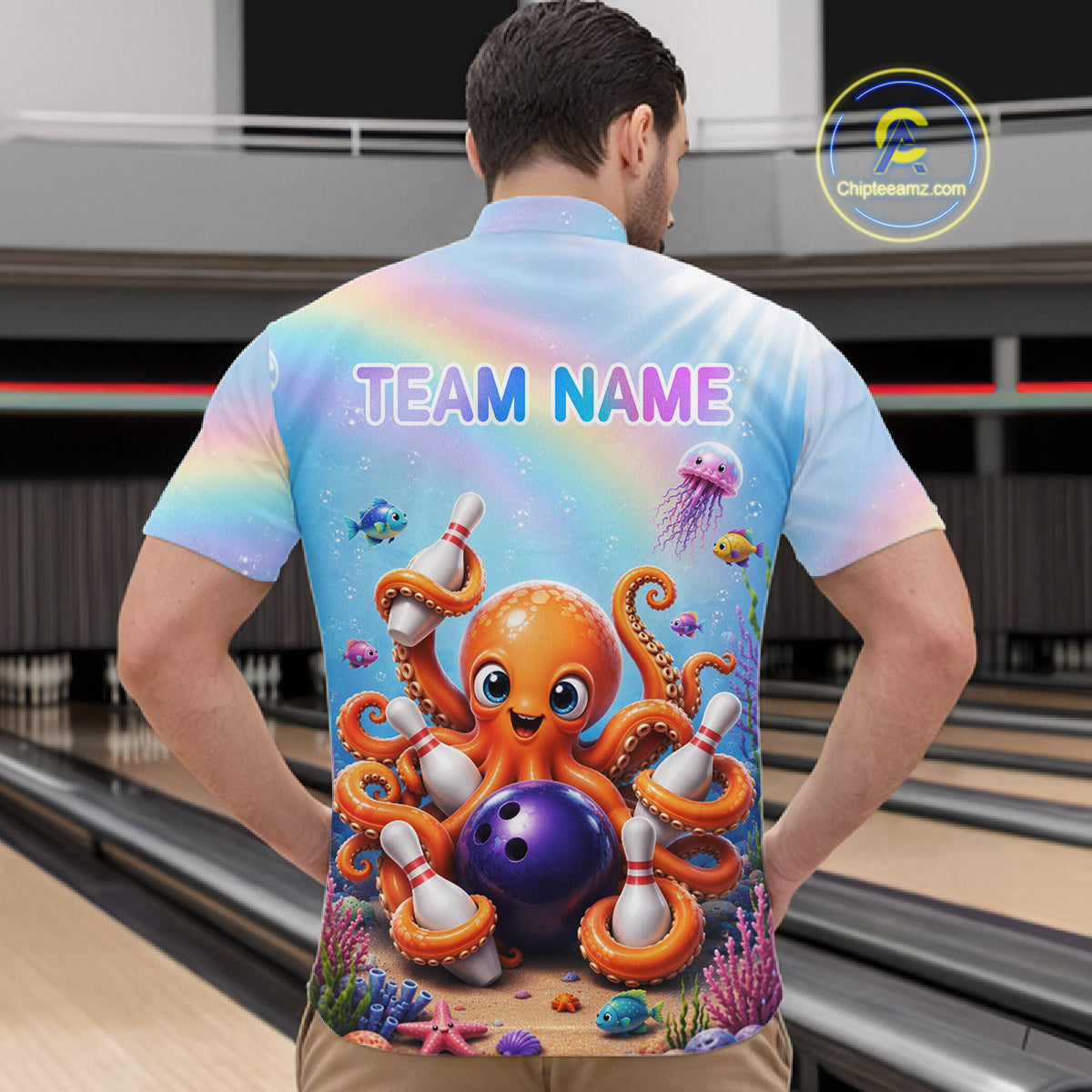 Back view of man wearing a rainbow octopus ocean bowling quarter zip shirt in a bowling alley.