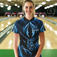 Load image into Gallery viewer, Female bowler wearing blue lightning bowling jersey during league event, custom athletic apparel representing precision, focus and resilience.