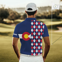 Load image into Gallery viewer, Male golfer wearing Colorado flag golf polo at scenic mountain golf course, perfect for golf vacations, outdoor adventure and state pride.