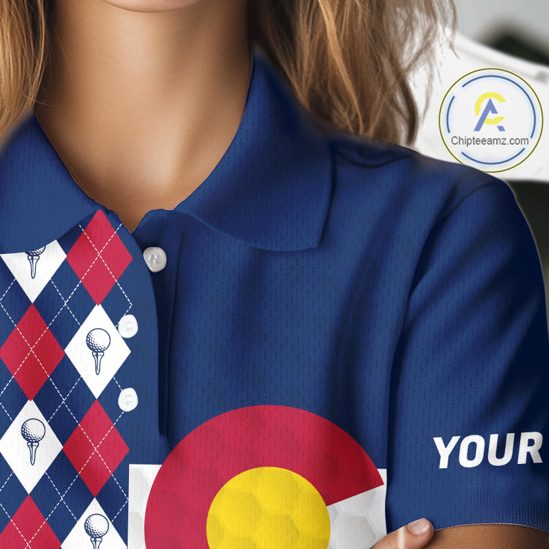 Female golfer wearing Colorado patriotic golf polo at country club, stylish golf apparel for tournaments and mountain golf trips.