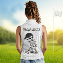 Load image into Gallery viewer, Female golfer wearing tropical skull golf polo on sunny golf course, fashionable golf apparel representing freedom, nature and resort living.
